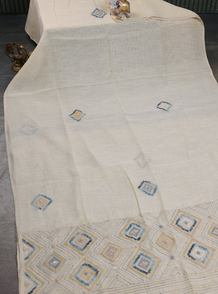 Tissue linen cotton saree cream and sandal with embroidery buttas and embroidery pallu