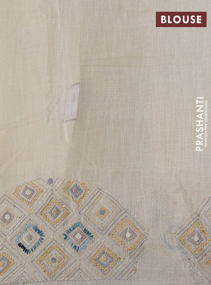 Tissue linen cotton saree cream and sandal with embroidery buttas and embroidery pallu