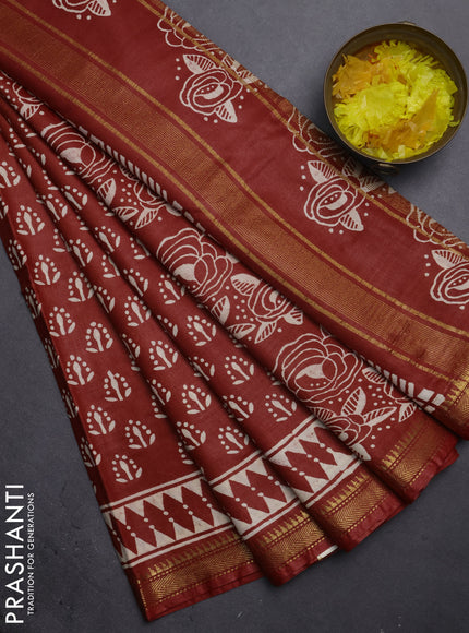 Semi bhagalpuri saree rust with allover prints and zari woven border