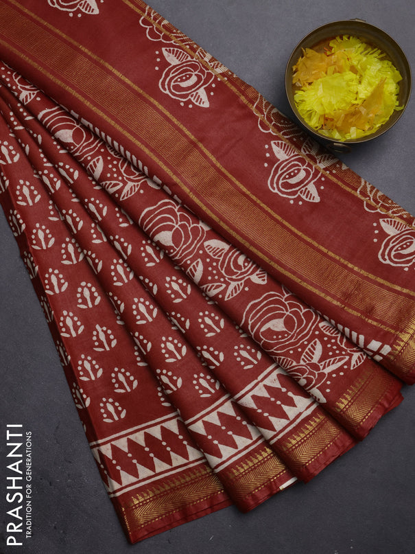 Semi bhagalpuri saree rust with allover prints and zari woven border