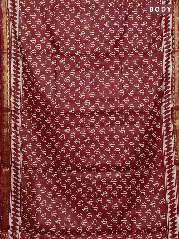 Semi bhagalpuri saree rust with allover prints and zari woven border