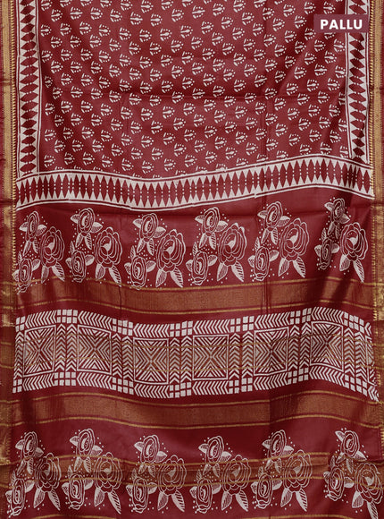 Semi bhagalpuri saree rust with allover prints and zari woven border