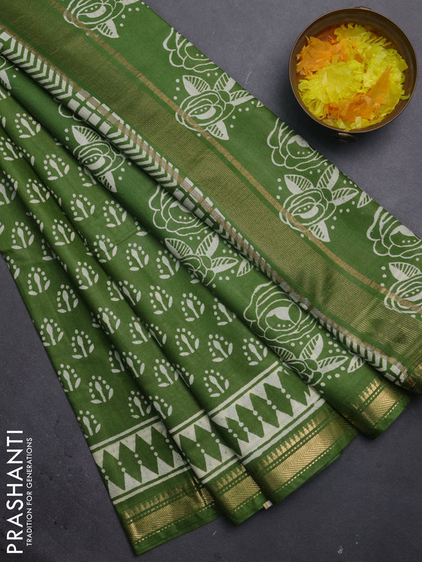 Semi bhagalpuri saree light green with allover prints and zari woven border