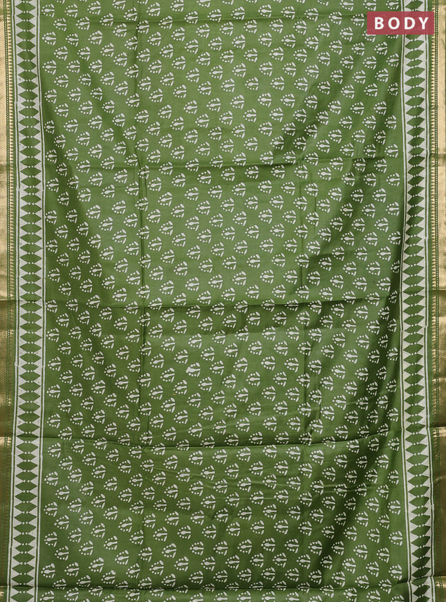 Semi bhagalpuri saree light green with allover prints and zari woven border