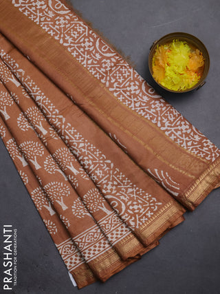 Semi bhagalpuri saree sandal with allover prints and zari woven border