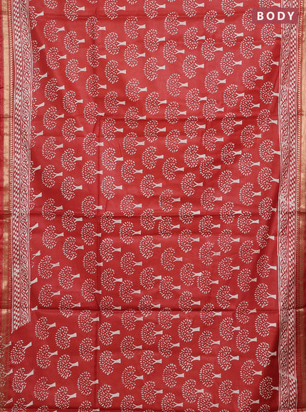 Semi bhagalpuri saree rust with allover prints and zari woven border