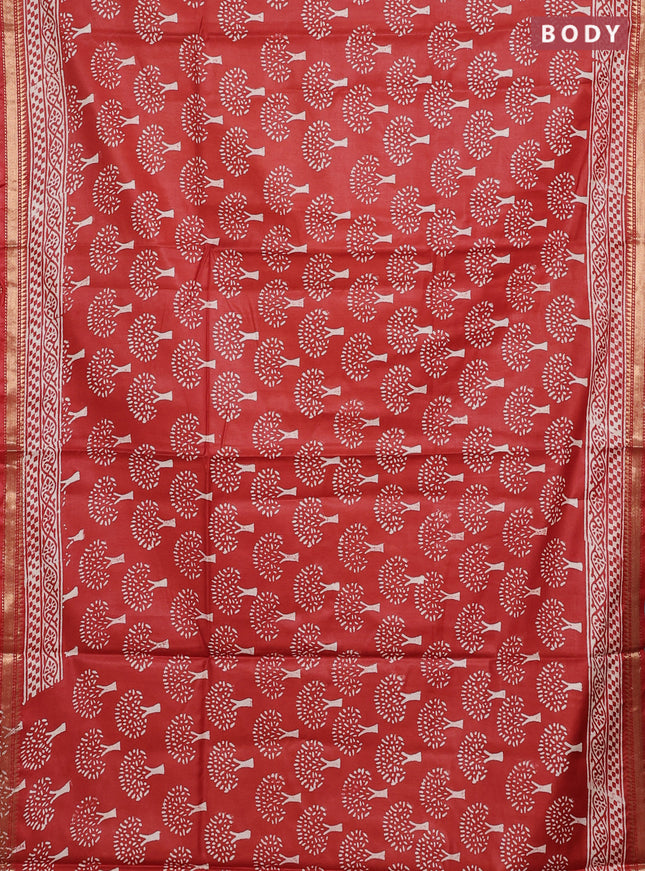 Semi bhagalpuri saree rust with allover prints and zari woven border
