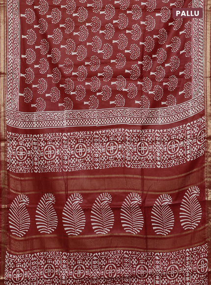 Semi bhagalpuri saree rust with allover prints and zari woven border