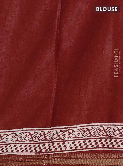 Semi bhagalpuri saree rust with allover prints and zari woven border