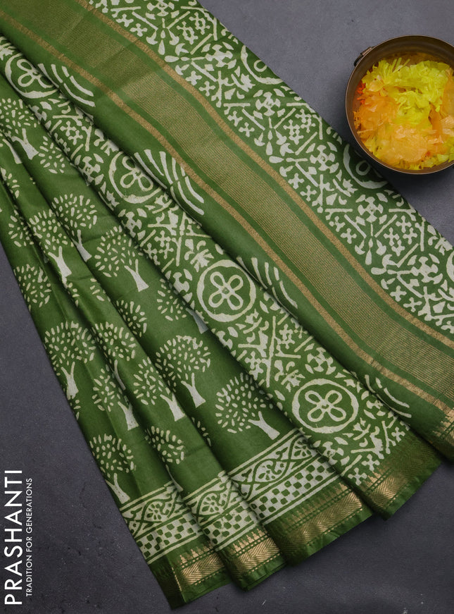 Semi bhagalpuri saree light green with allover prints and zari woven border