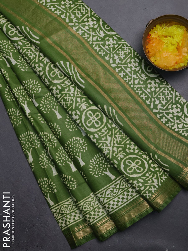 Semi bhagalpuri saree light green with allover prints and zari woven border