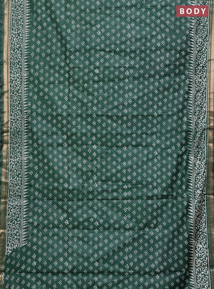 Semi bhagalpuri saree bottle green with allover prints and zari woven border