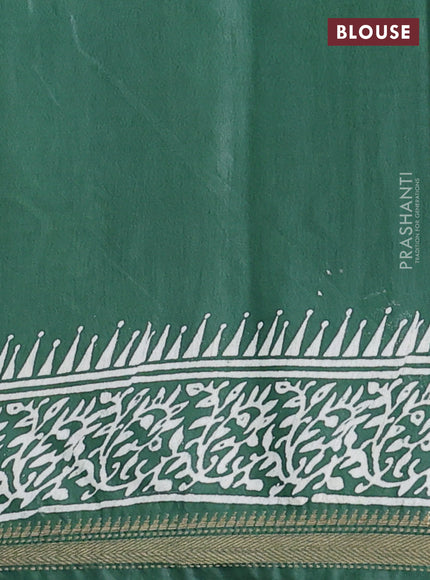 Semi bhagalpuri saree bottle green with allover prints and zari woven border