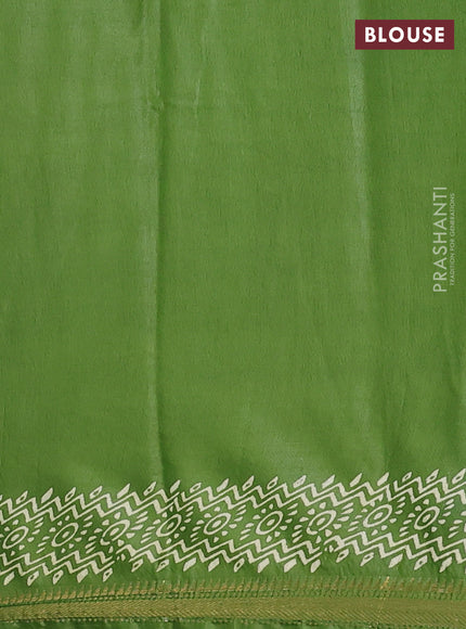Semi bhagalpuri saree leaf green with allover prints and zari woven border