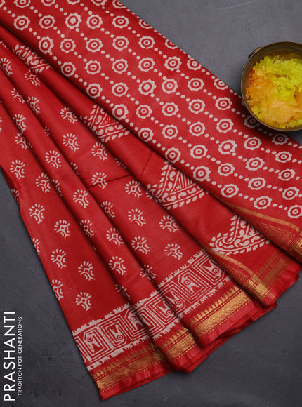 Semi bhagalpuri saree rust with allover prints and zari woven border