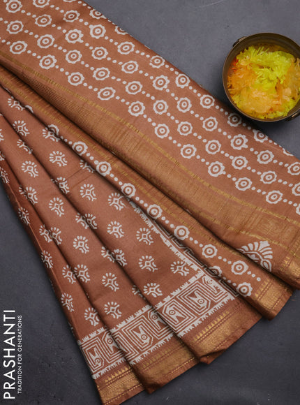 Semi bhagalpuri saree sandal with allover prints and zari woven border