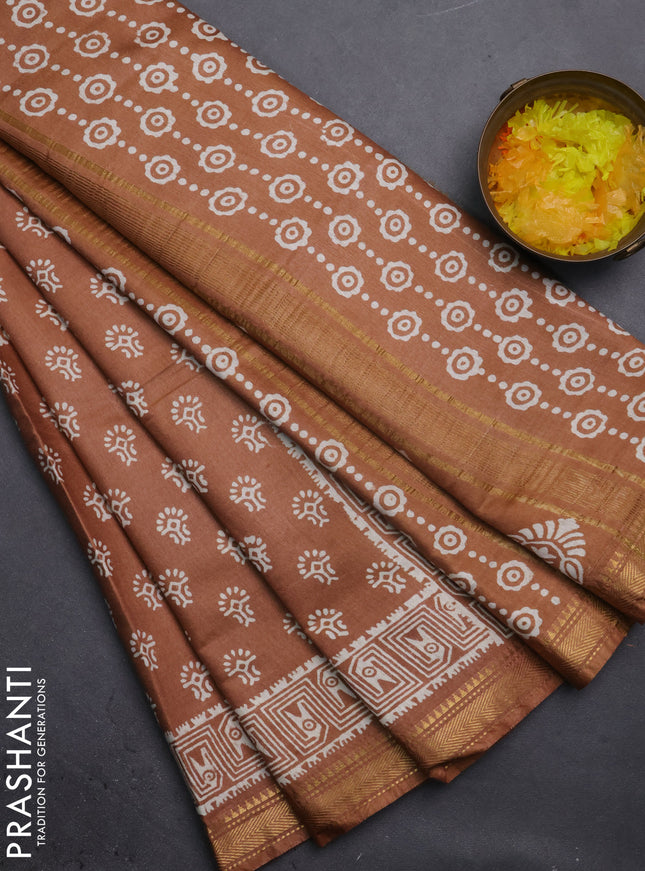 Semi bhagalpuri saree sandal with allover prints and zari woven border