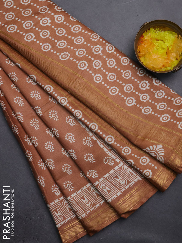 Semi bhagalpuri saree sandal with allover prints and zari woven border