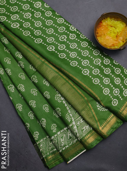 Semi bhagalpuri saree light green with allover prints and zari woven border