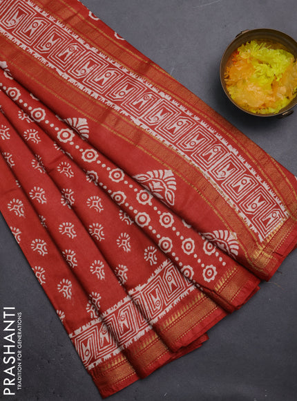 Semi bhagalpuri saree rust with allover prints and zari woven border