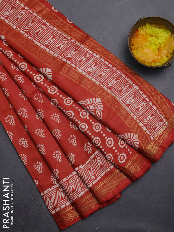 Semi bhagalpuri saree rust with allover prints and zari woven border