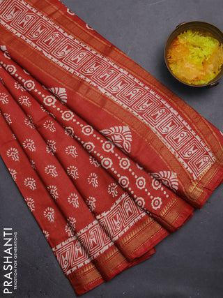 Semi bhagalpuri saree rust with allover prints and zari woven border