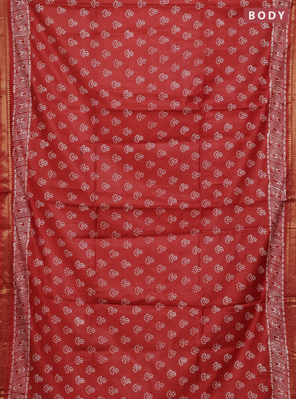 Semi bhagalpuri saree rust with allover prints and zari woven border
