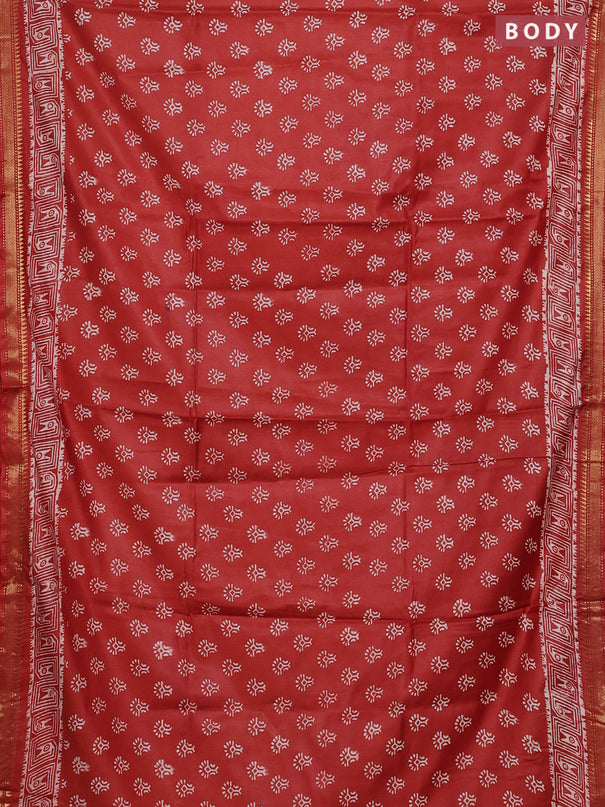 Semi bhagalpuri saree rust with allover prints and zari woven border