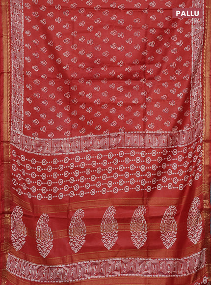 Semi bhagalpuri saree rust with allover prints and zari woven border