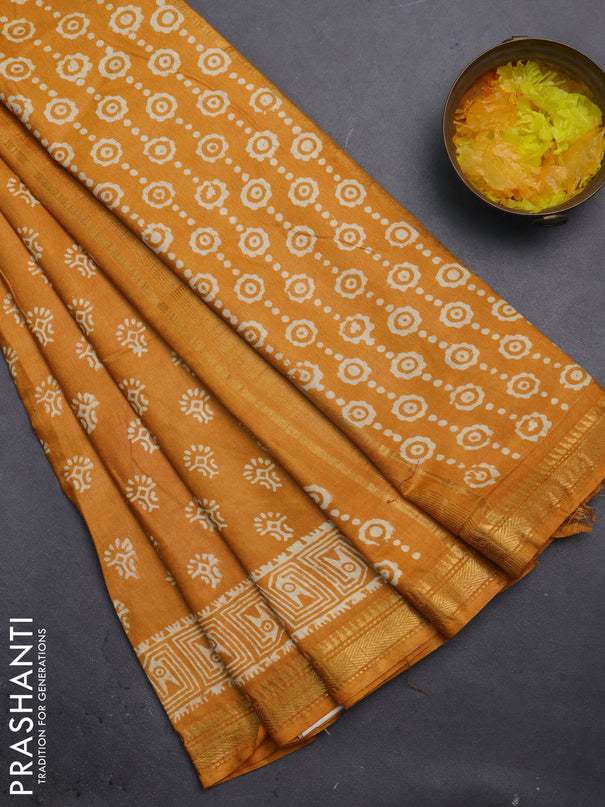 Semi bhagalpuri saree mustard yellow with allover prints and zari woven border