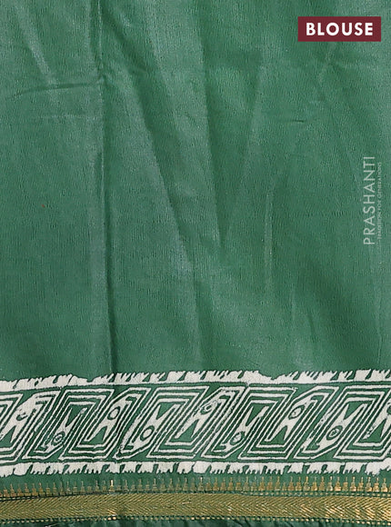 Semi bhagalpuri saree bottle green with allover prints and zari woven border
