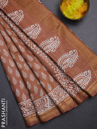 Semi bhagalpuri saree sandal with allover prints and zari woven border