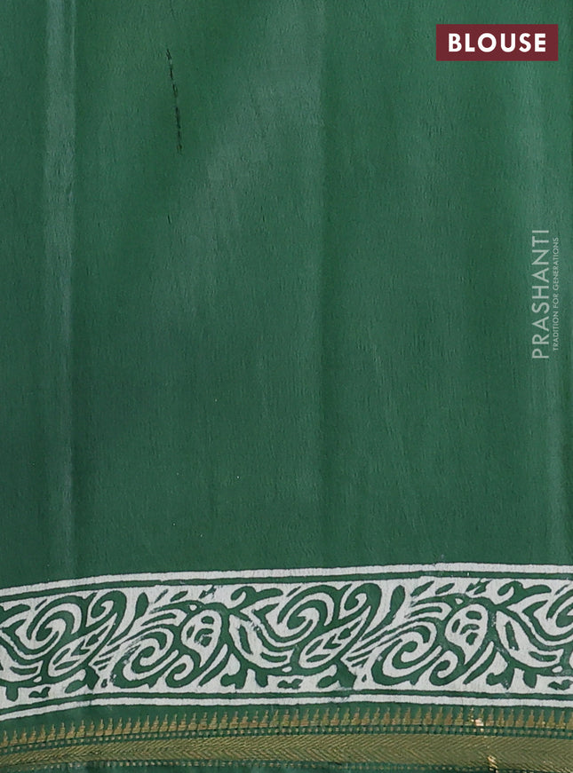 Semi bhagalpuri saree bottle green with allover prints and zari woven border