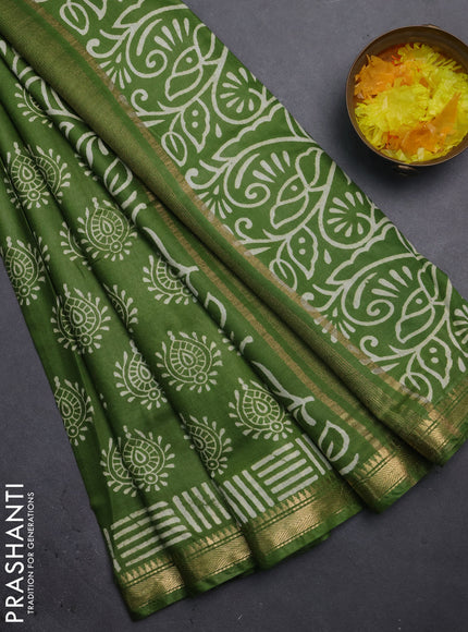 Semi bhagalpuri saree light green with allover prints and zari woven border