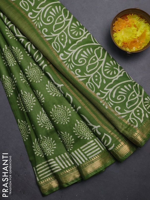 Semi bhagalpuri saree light green with allover prints and zari woven border
