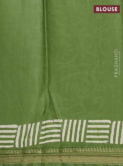 Semi bhagalpuri saree light green with allover prints and zari woven border