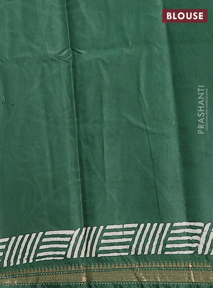 Semi bhagalpuri saree bottle green with allover prints and zari woven border