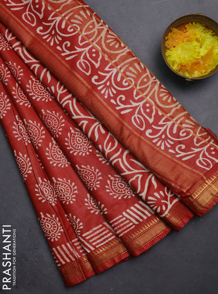 Semi bhagalpuri saree rust with allover prints and zari woven border