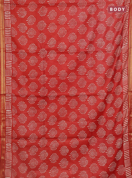 Semi bhagalpuri saree rust with allover prints and zari woven border