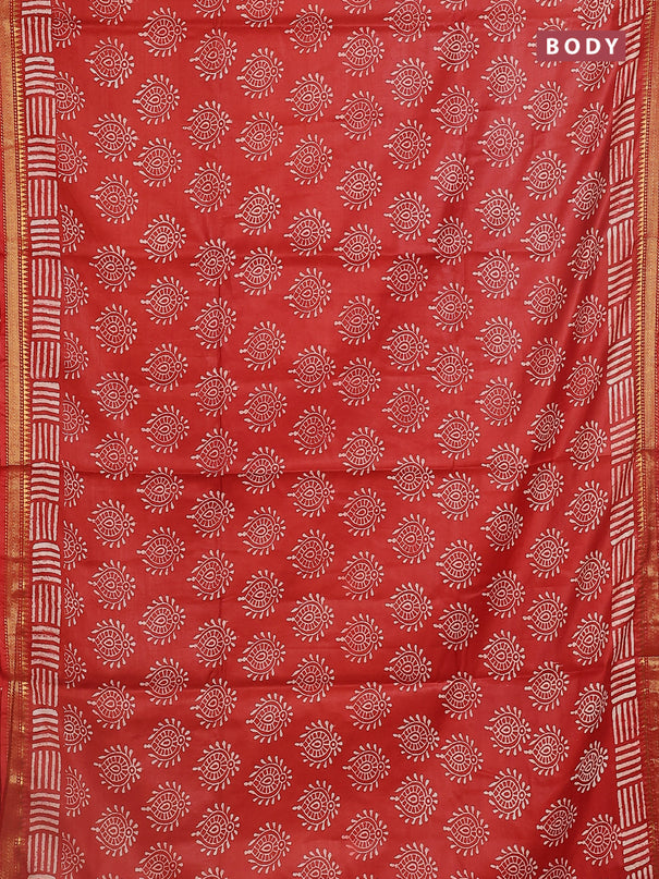 Semi bhagalpuri saree rust with allover prints and zari woven border