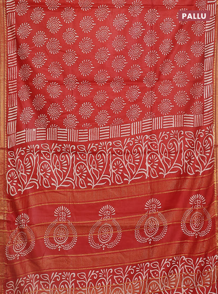 Semi bhagalpuri saree rust with allover prints and zari woven border