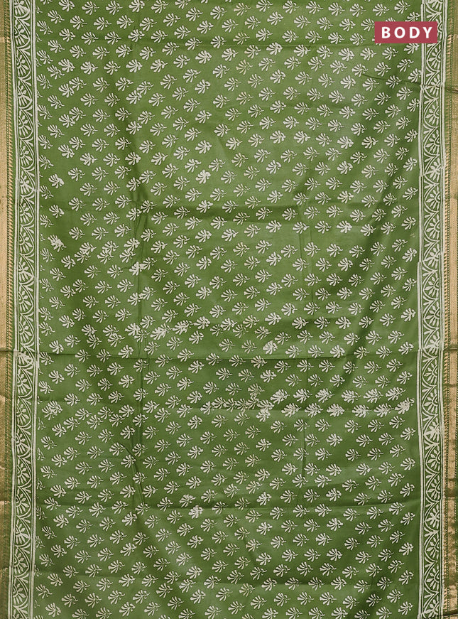 Semi bhagalpuri saree light green with allover prints and zari woven border