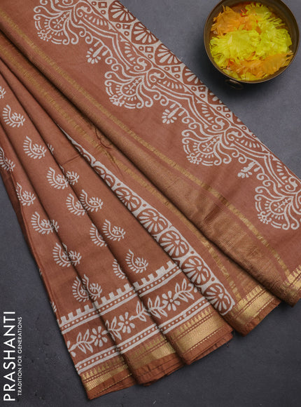 Semi bhagalpuri saree sandal with allover prints and zari woven border