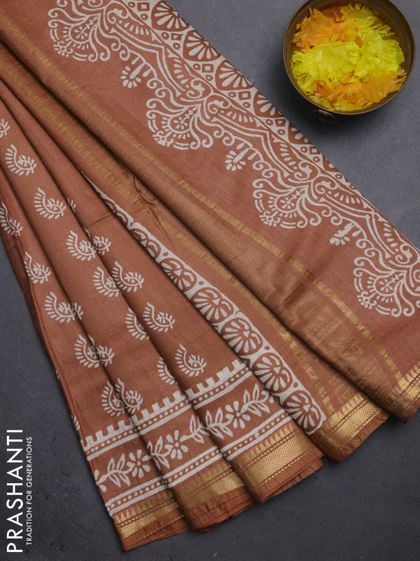 Semi bhagalpuri saree sandal with allover prints and zari woven border