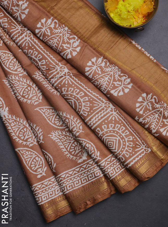 Semi bhagalpuri saree sandal with allover prints and zari woven border