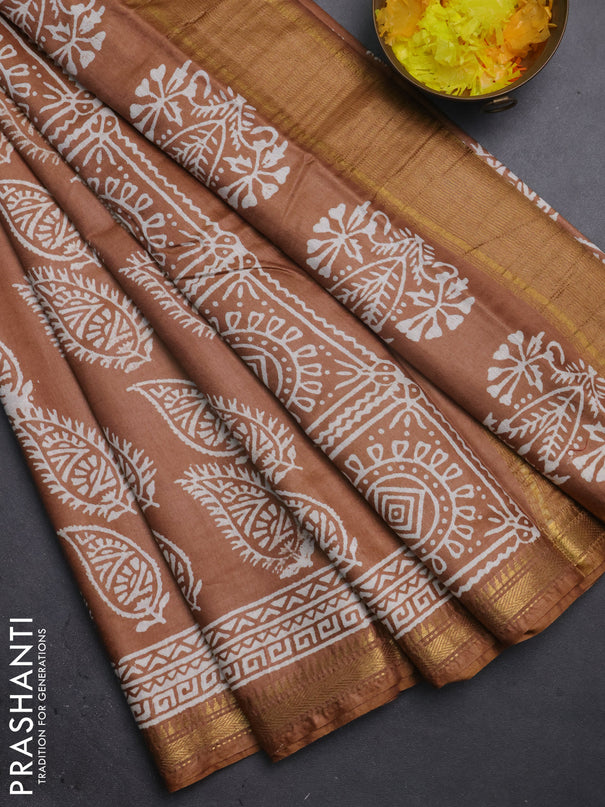 Semi bhagalpuri saree sandal with allover prints and zari woven border