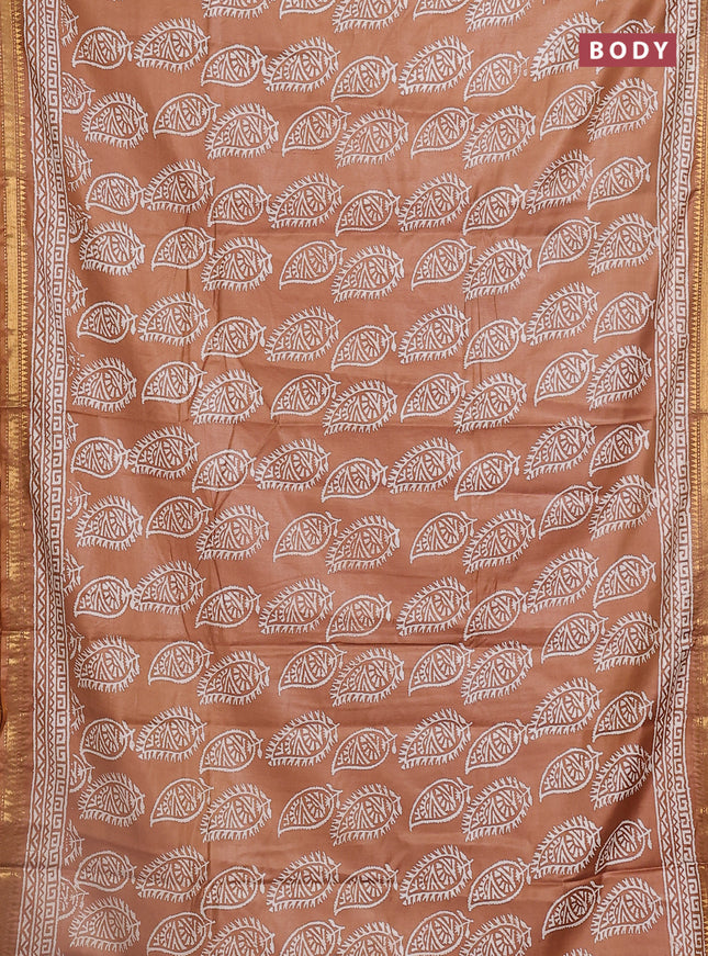 Semi bhagalpuri saree sandal with allover prints and zari woven border