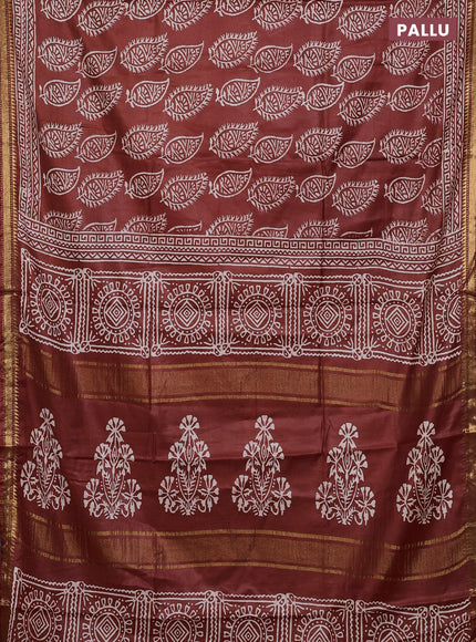 Semi bhagalpuri saree rust with allover prints and zari woven border
