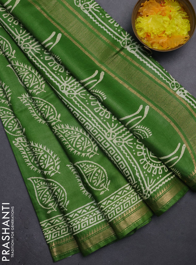 Semi bhagalpuri saree light green with allover prints and zari woven border