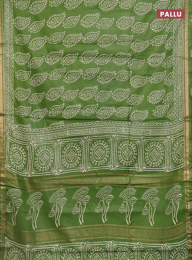 Semi bhagalpuri saree light green with allover prints and zari woven border